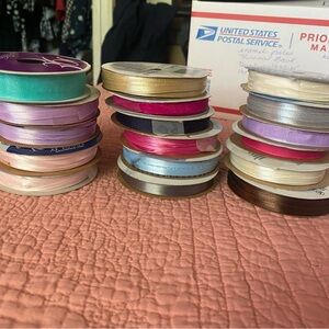 Assorted Ribbon Spools 17. Most of them are completely full.